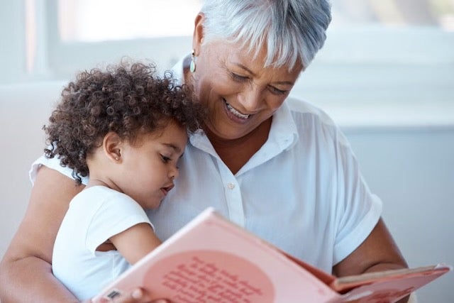 A woman is holding a kid