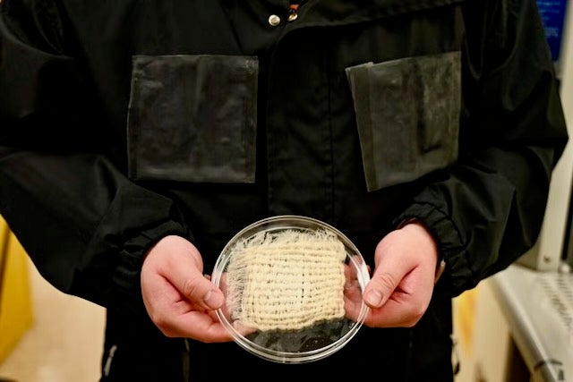 The textile incorporated into the jacket collects moisture and funnels it to detachable harvesting units