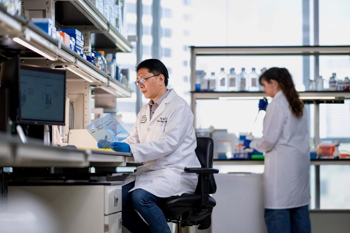 Dr. Boyi Gan and a research assistant work together in his lab at The University of Texas MD Anderson Cancer Center