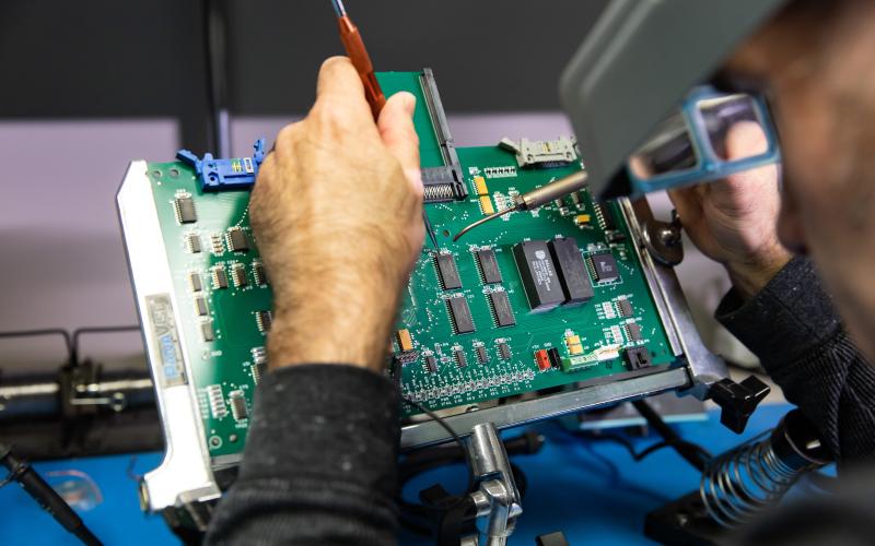 Technician repairing circuit board